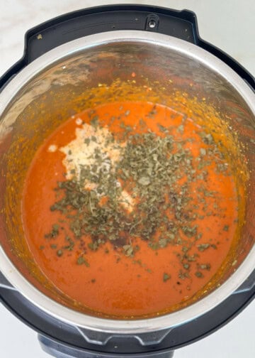 add fenugreek leaves into the instant pot for butter chicken