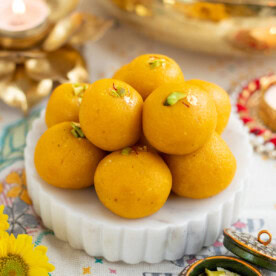 Mango coconut almond ladoo on a marble platter