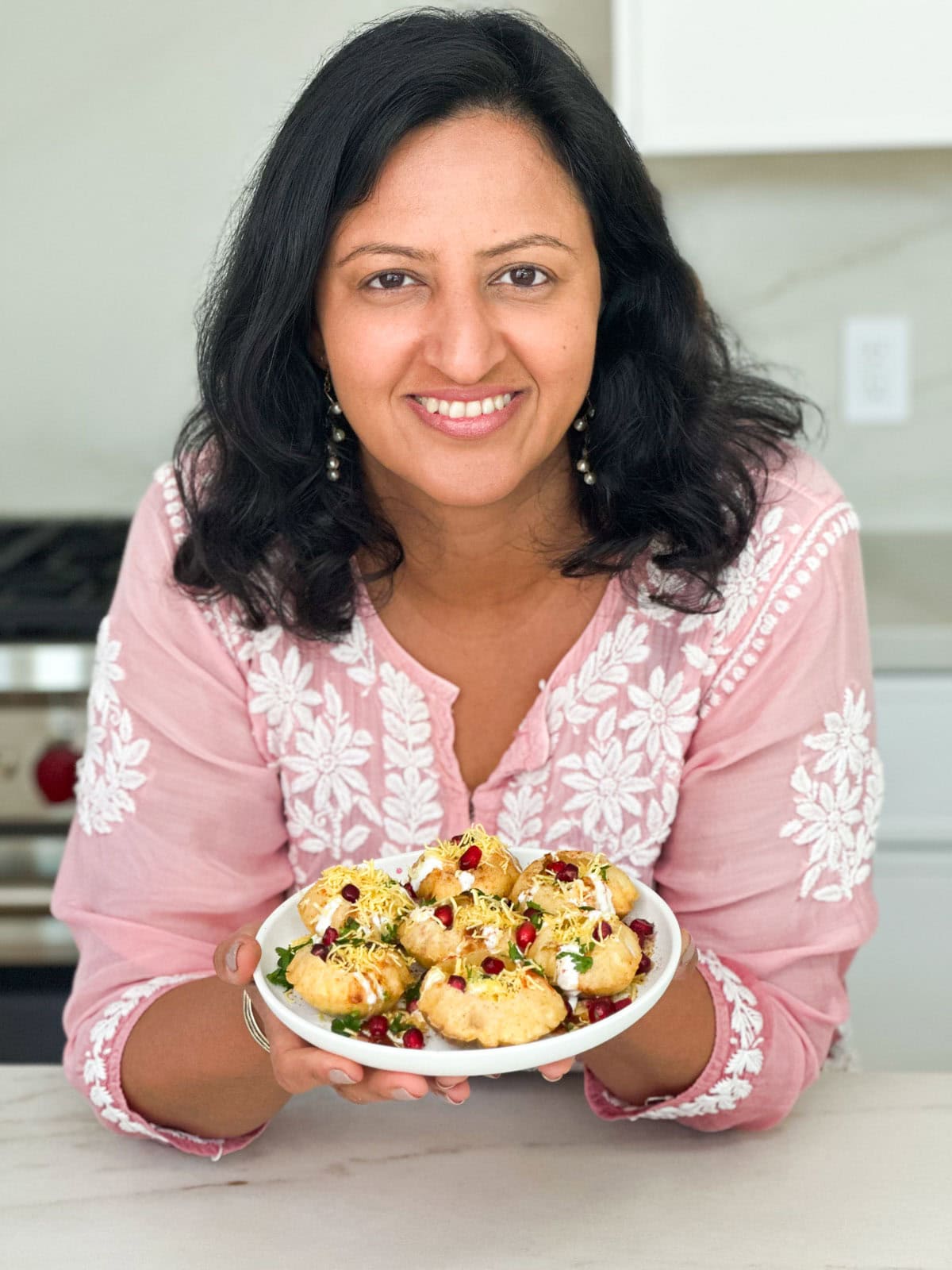 Showing a plate of dahi puri