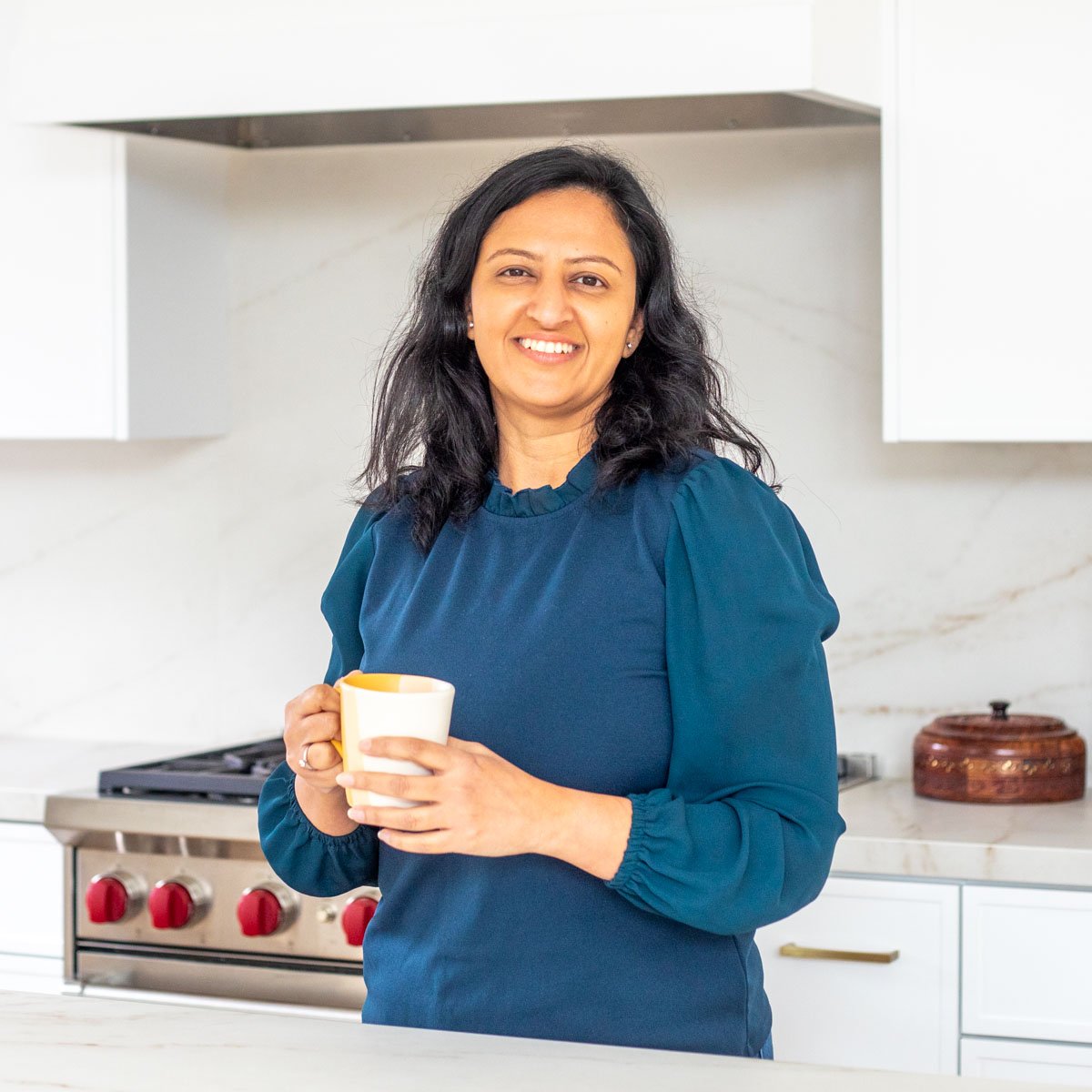 Meeta, owner of Piping Pot Curry in her kitchen