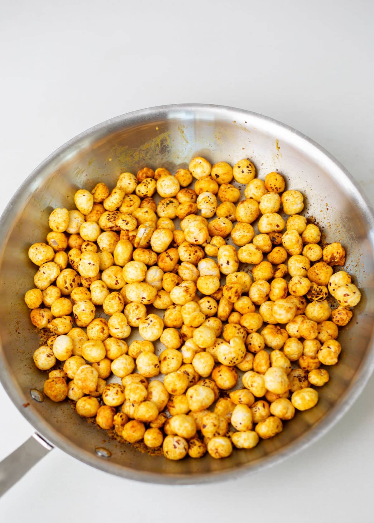 Roasted makhana in a stainless steel pan