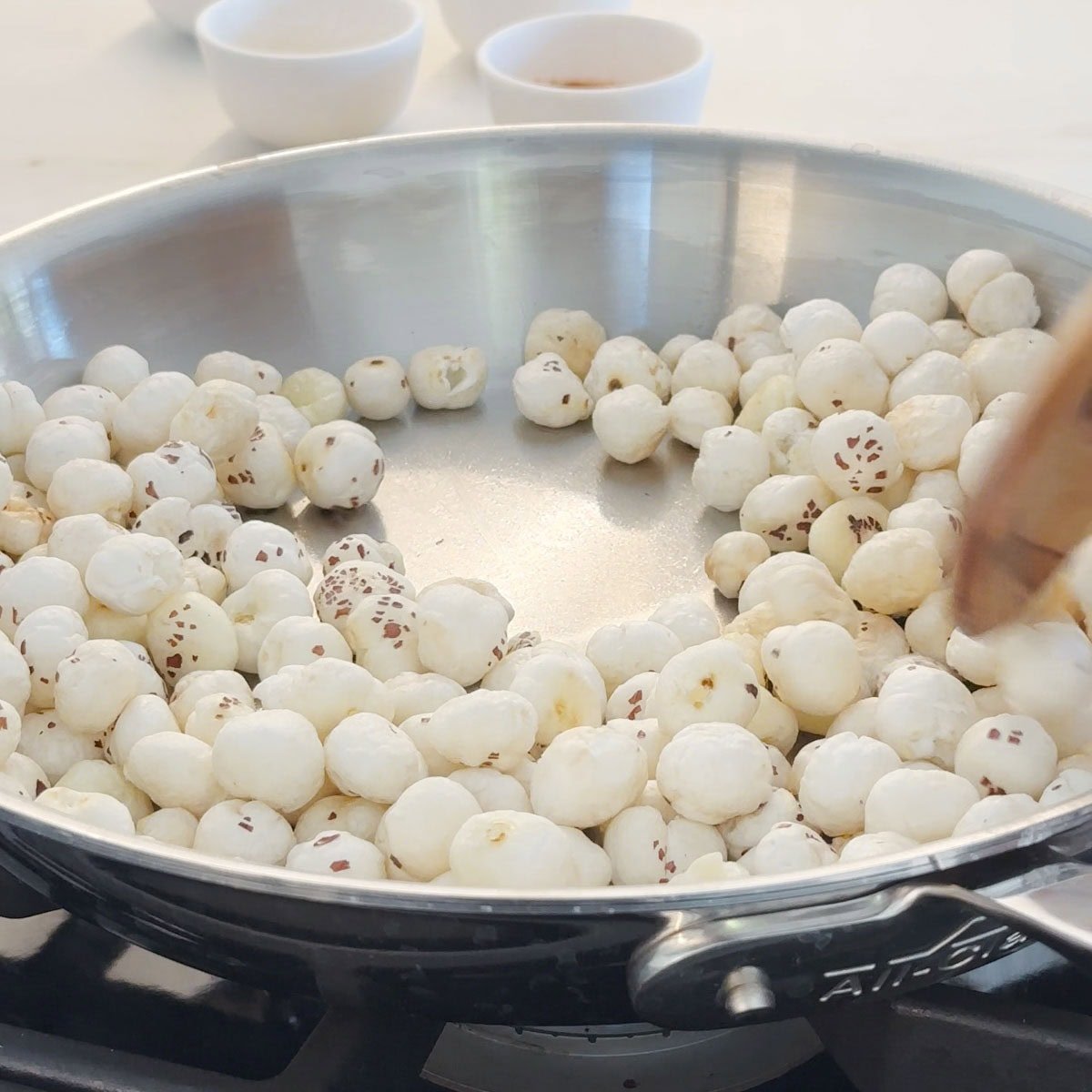 Roast foxnuts in a pan for roasted makhana recipe