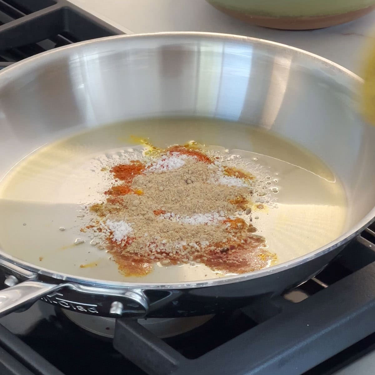 Add spices into the pan for roasted makahana recipe