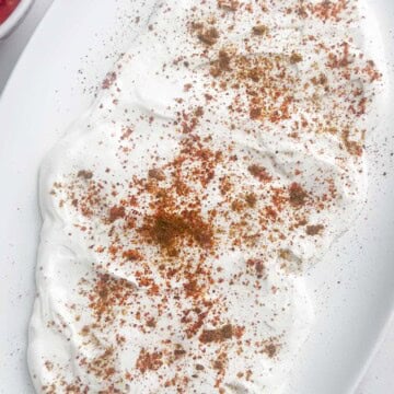 Add chaat on top of curd to make chaat platter