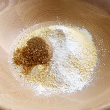 Add dry ingredients into the bowl to make jalapeno cheddar cornbread