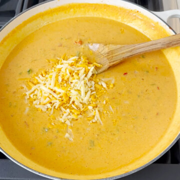 Add cheese in the pan for mac and cheese sauce