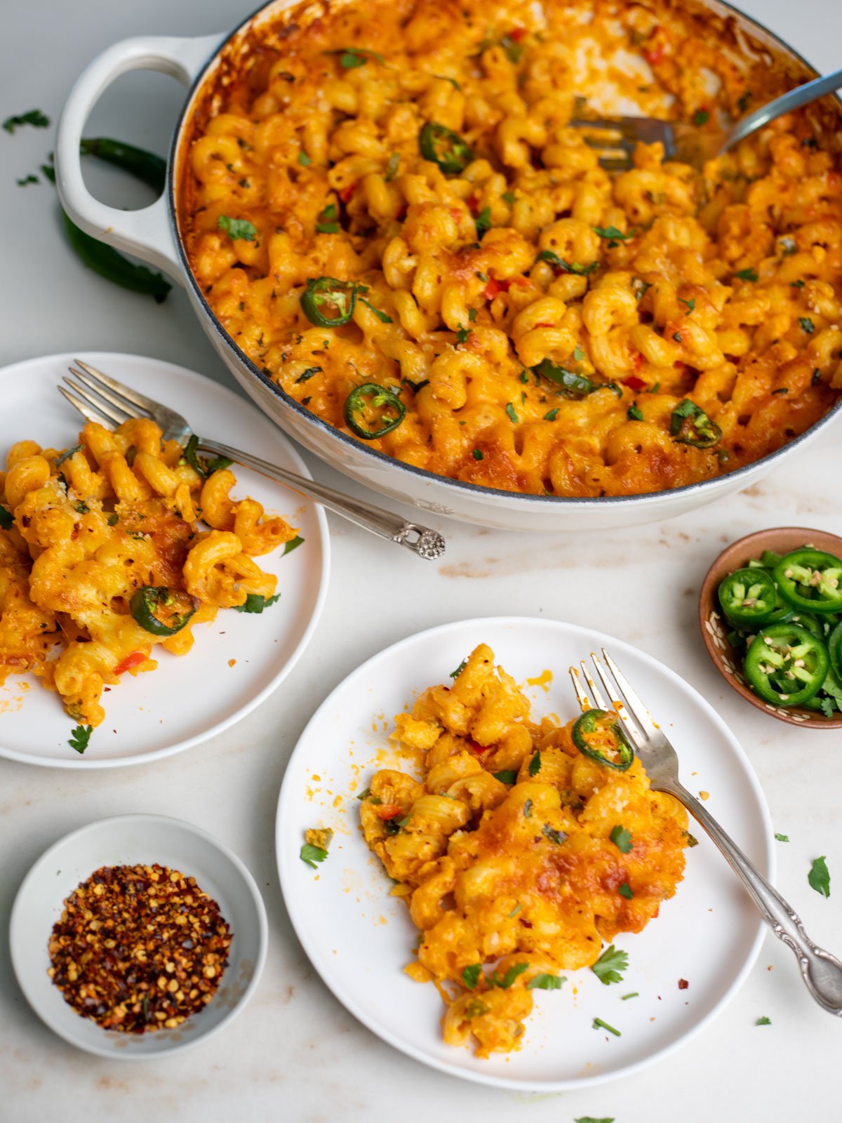 Ready to serve masala mac and cheese in two white saucer