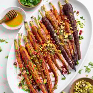 Roasted rainbow carrot over yogurt sauce in a platter