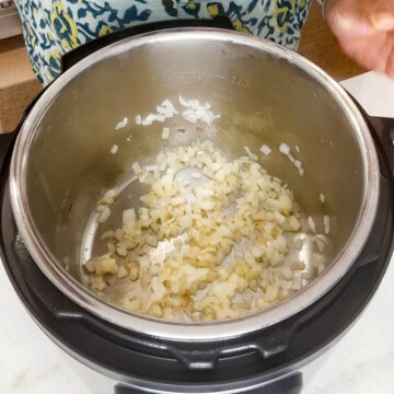 Saute onion into the instant pot for chicken noodle soup