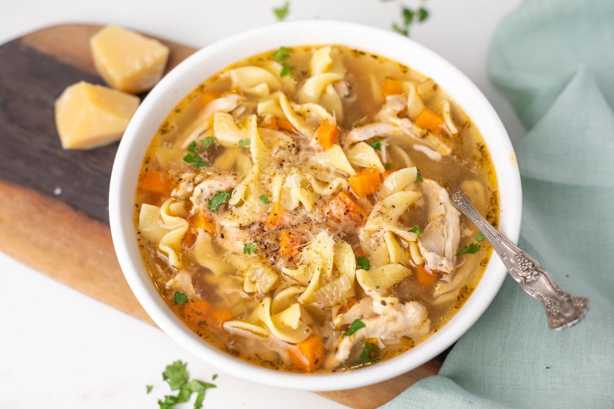 Easy Instant Pot Chicken noodle soup in a white bowl.