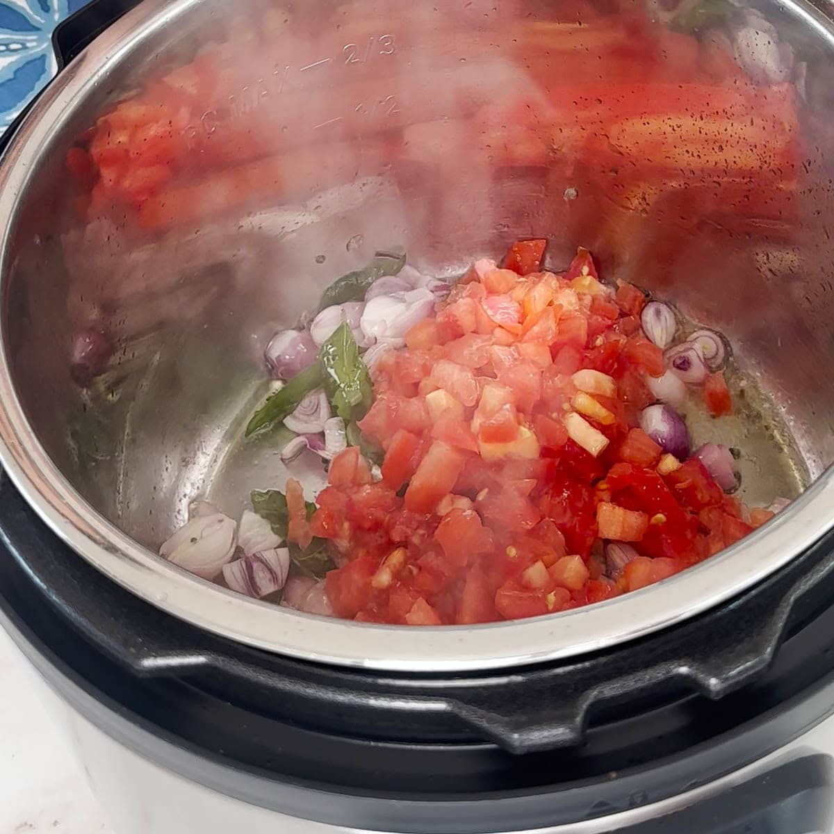 Add aromatics and tomatoes to make sambar.