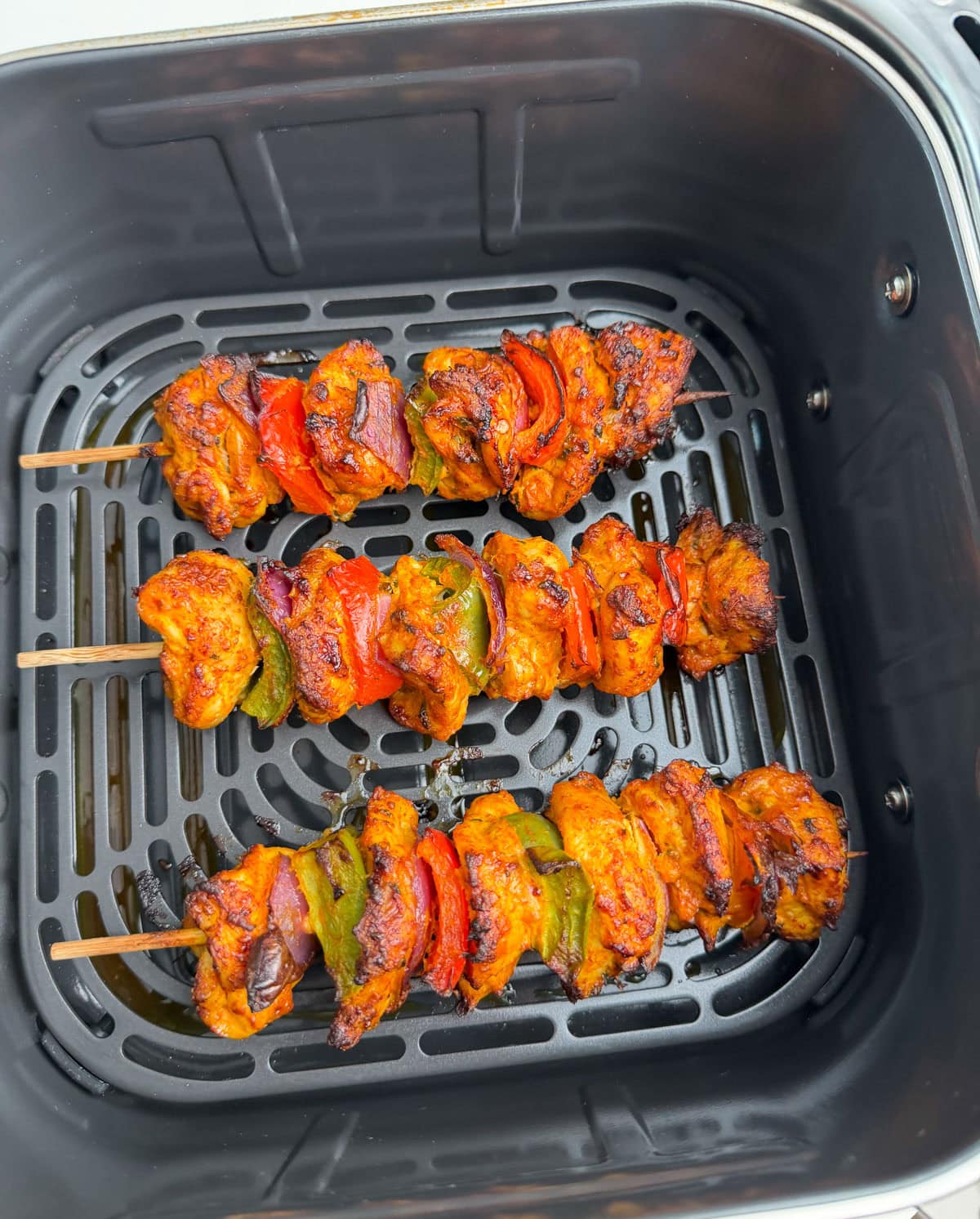 Chicken tikka kebab skewers cooked in the air fryer.