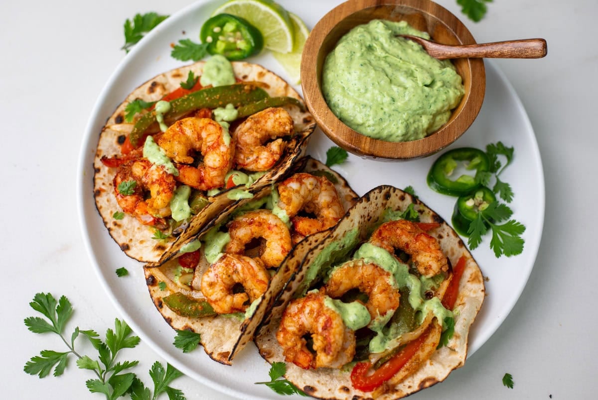 Shrimp fajita on a plate with green chutney