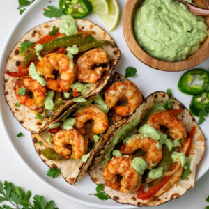 Top view of fajita shrimp tacos on a plate
