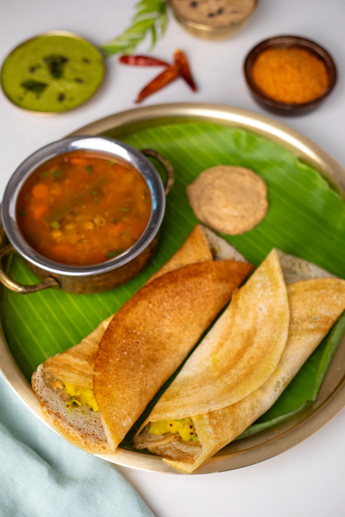 Homemade masala dosa on a barass plate