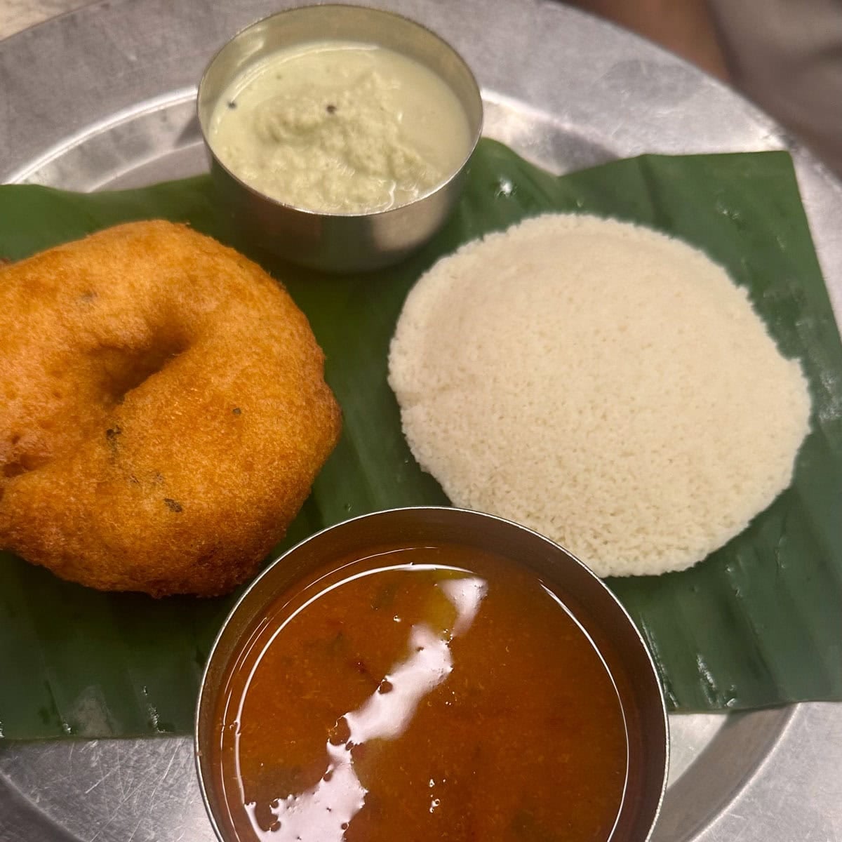 Idli and Medu vada served with sambar and chutney.