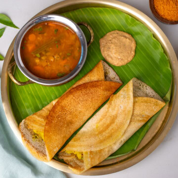 Top view of masala dosa on a brass plate