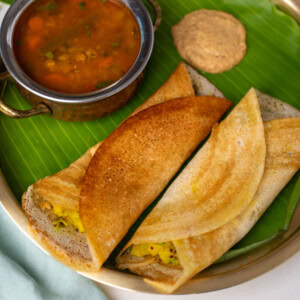 Masala dosa served with sambar and chutney