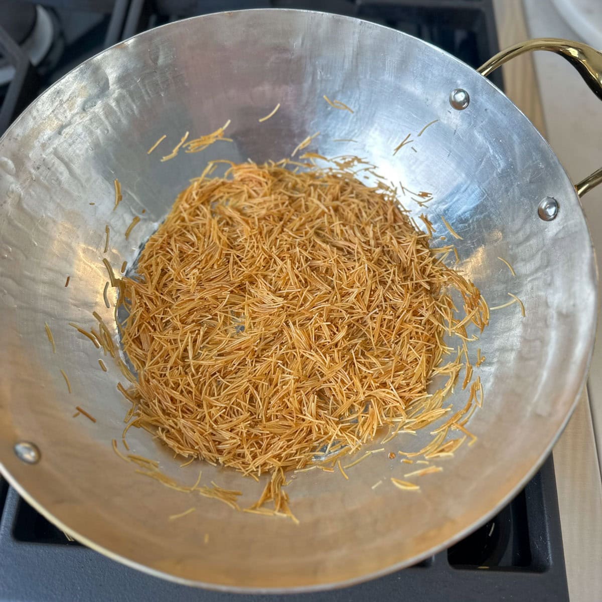 Roasted vermicelli in ghee to make payasam.
