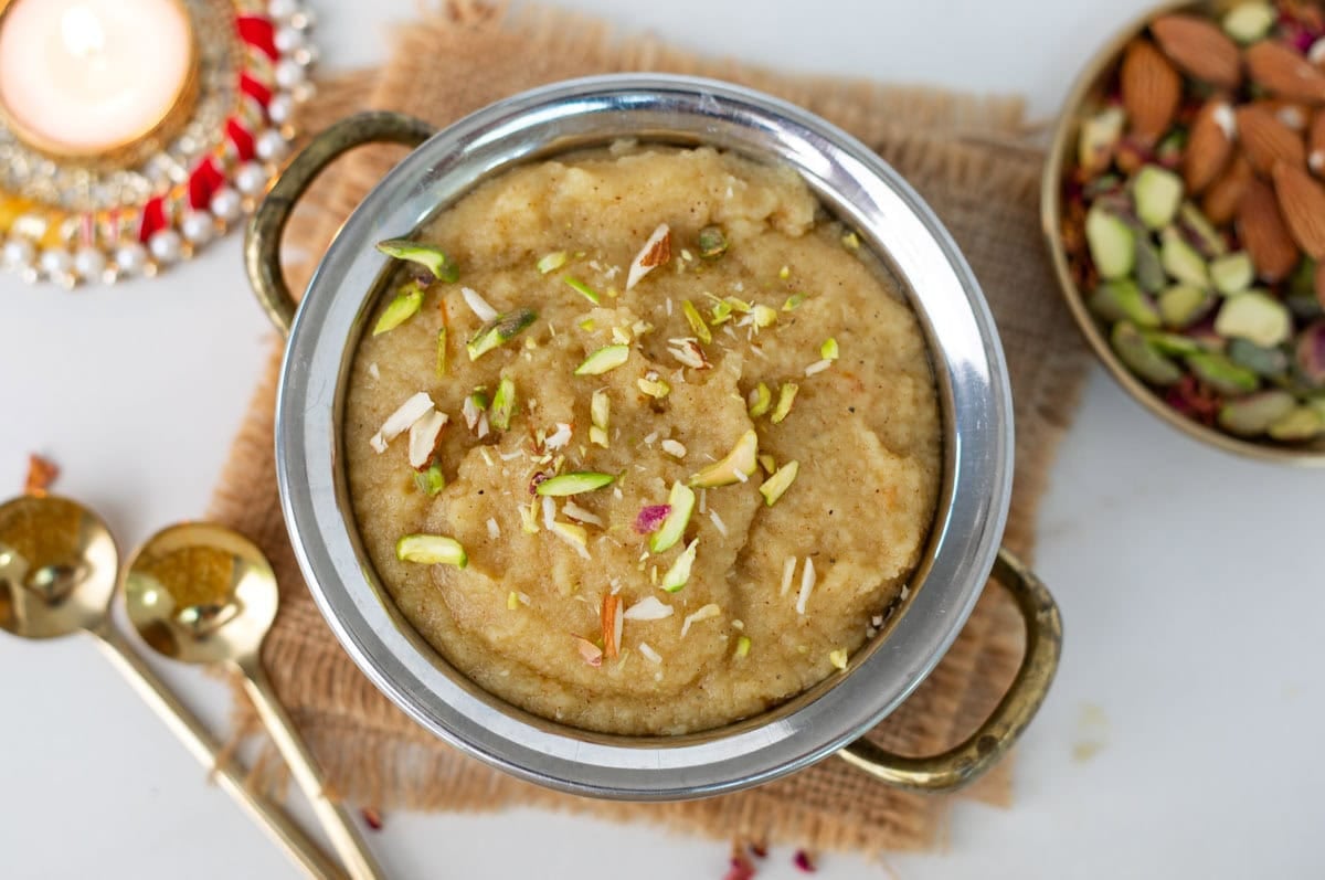 Sooji ka halwa (Indian Halwa) served in a bowl, and topped with slivered nuts.
