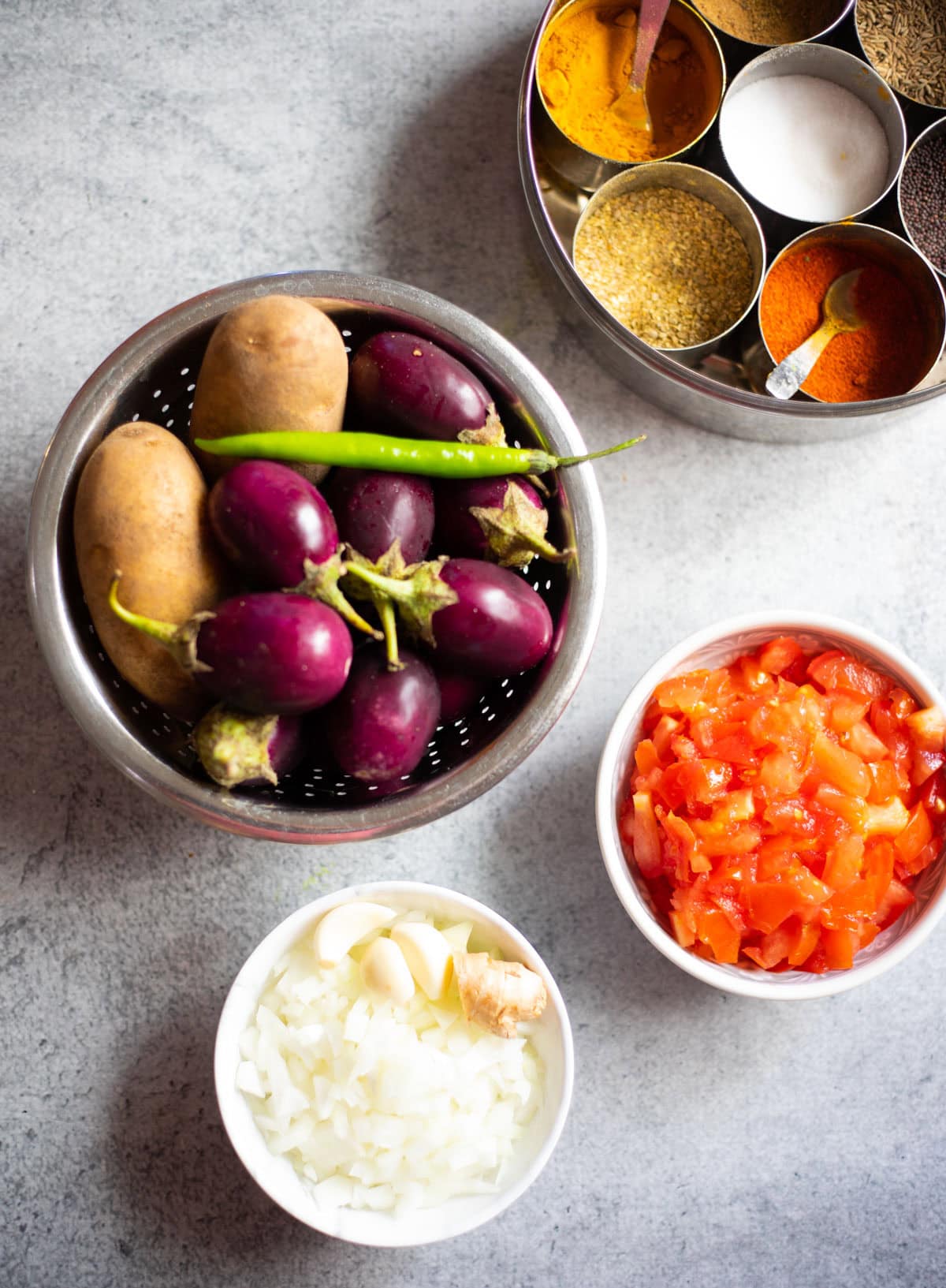 Ingredients to make aloo baingan (potato eggplant curry)