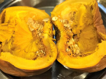 Perfectly cooked Instant Pot pumpkin cut in half.