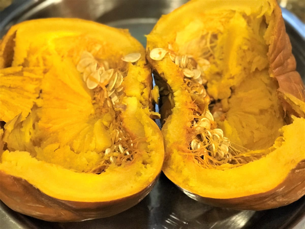 Perfectly cooked Instant Pot pumpkin cut in half.