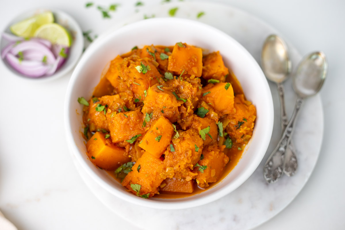 Ready to serve Indian Instant Pot pumpkin curry in a white bowl